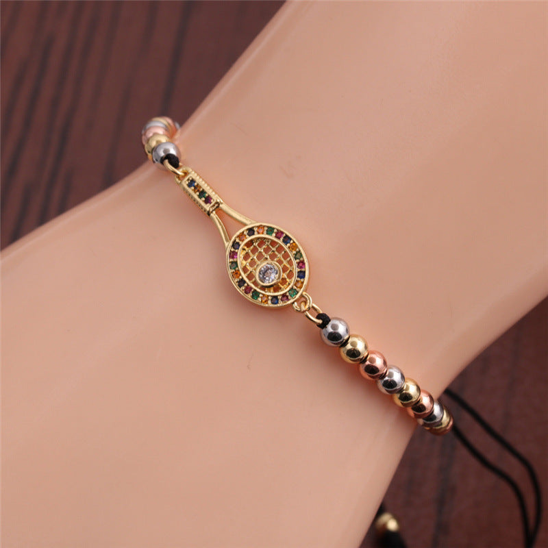 Elegant Gold Tennis Racket Charm Bracelet with Sparkling Rhinestone Detail