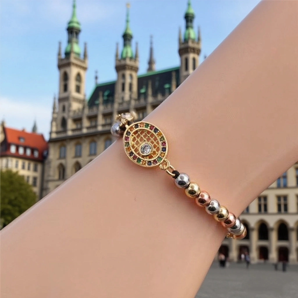 Elegant Gold Tennis Racket Charm Bracelet with Sparkling Rhinestone Detail